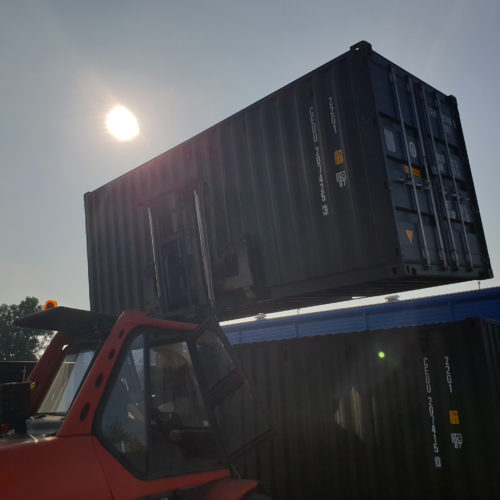 Container Stacking - Our onsite forklift double stacking 20ft containers.