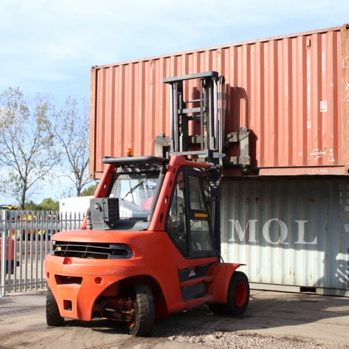 Stacking the containers - Double stacking 20ft used shipping containers on site.
